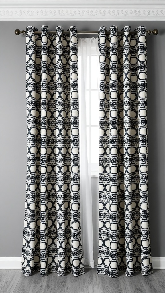 Black and white patterned curtains hanging in front of a window on grey walls.